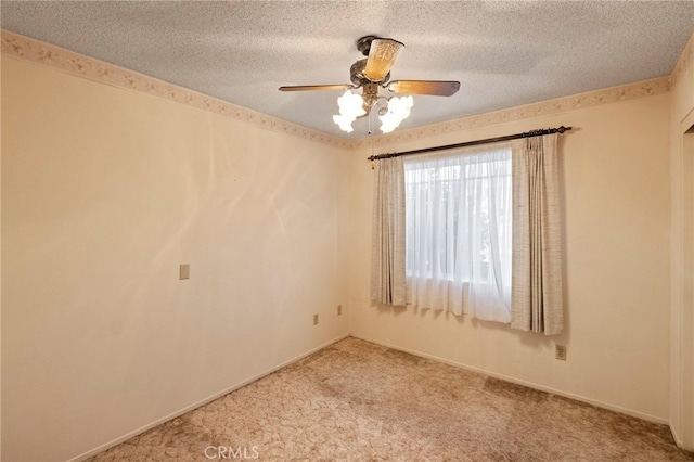 unfurnished room featuring ceiling fan, light carpet, and a textured ceiling