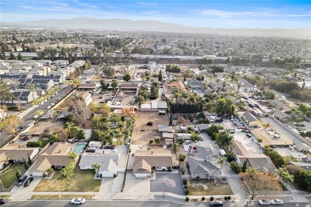 drone / aerial view featuring a mountain view