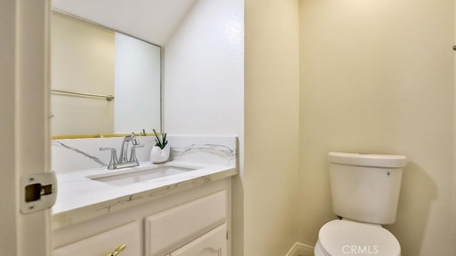 bathroom with toilet and vanity