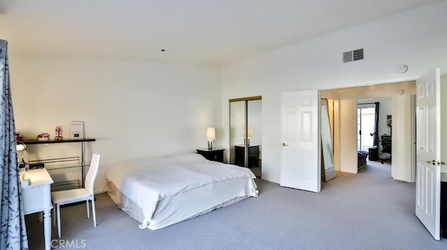 carpeted bedroom with a closet