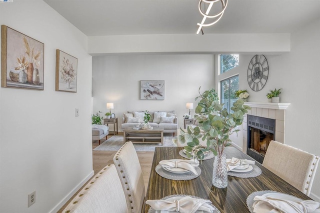 dining room with a tile fireplace