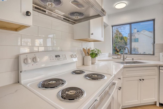 kitchen with extractor fan, white electric range, decorative backsplash, sink, and white cabinets