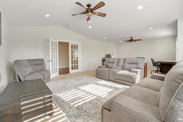 living room with ceiling fan, carpet, lofted ceiling, and french doors