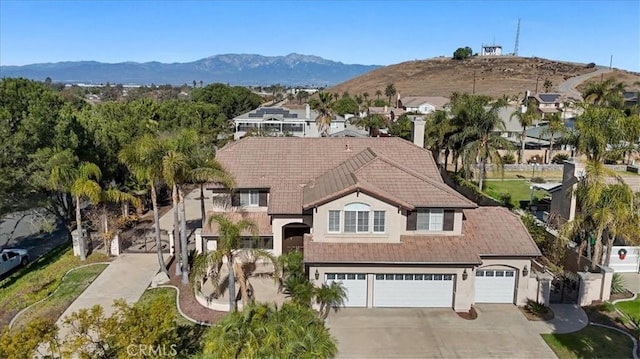 birds eye view of property with a mountain view