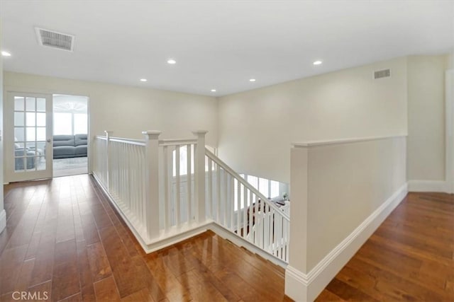 hall with dark hardwood / wood-style flooring