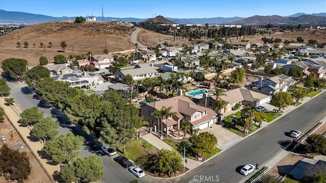 birds eye view of property with a mountain view