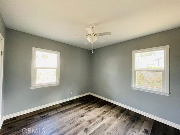 unfurnished room featuring ceiling fan, a healthy amount of sunlight, and hardwood / wood-style floors