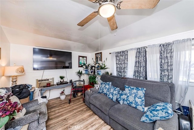 living room with ceiling fan, wood-type flooring, and an AC wall unit