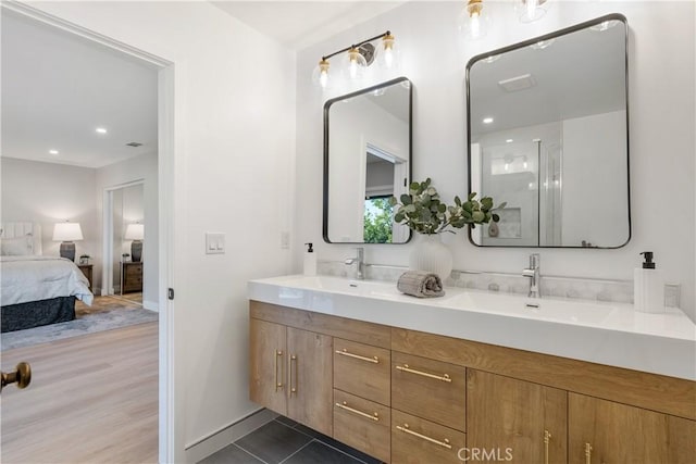 bathroom with vanity and tile patterned flooring