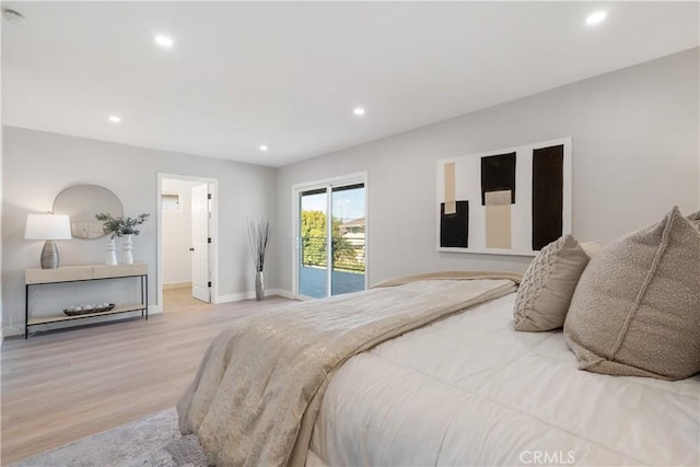 bedroom featuring light hardwood / wood-style floors and access to outside