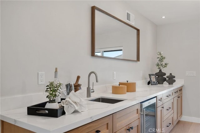 bathroom featuring sink and beverage cooler