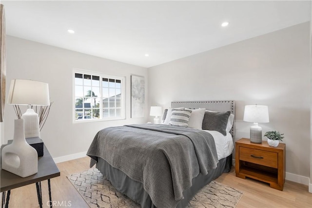 bedroom with light hardwood / wood-style floors