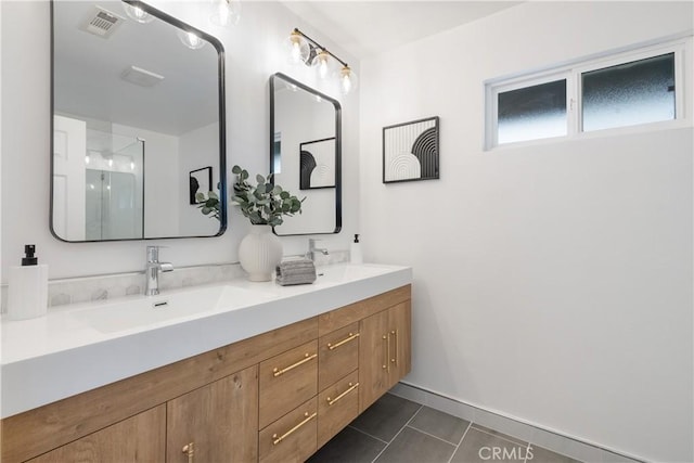 bathroom featuring vanity and tile patterned flooring