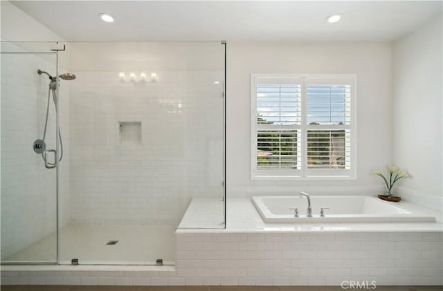 bathroom with independent shower and bath