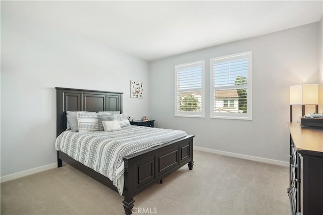 bedroom with light carpet