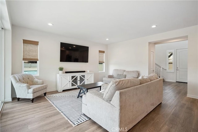 living room featuring a wealth of natural light and hardwood / wood-style floors