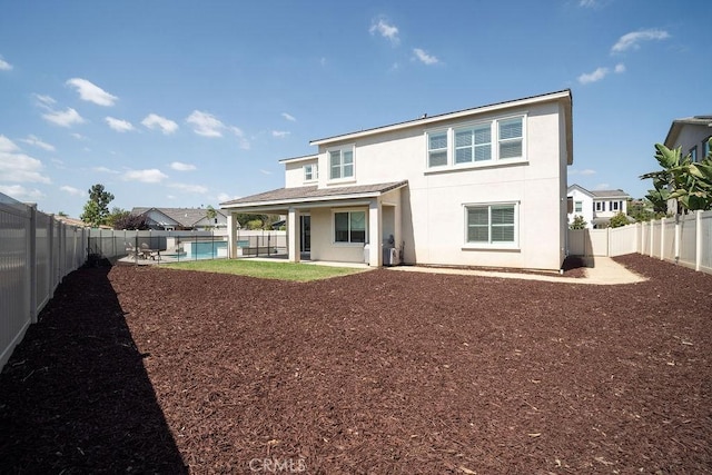 back of house featuring a patio area