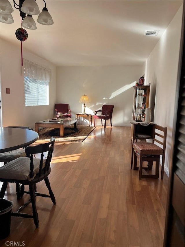 dining space featuring wood-type flooring