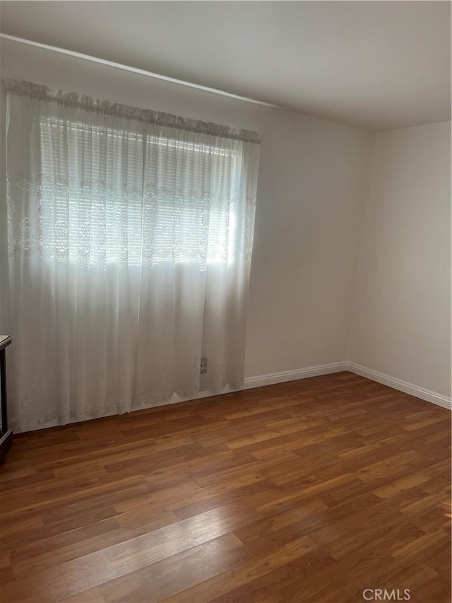 empty room featuring hardwood / wood-style flooring