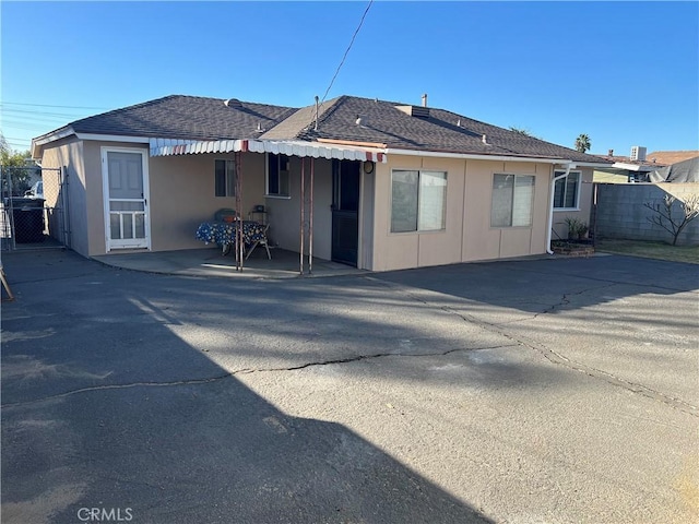 rear view of property with a patio area