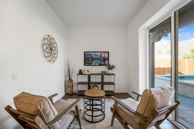 living area with hardwood / wood-style floors