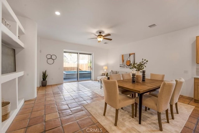 dining area featuring light tile patterned floors and ceiling fan