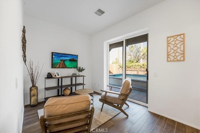 living area with dark hardwood / wood-style flooring