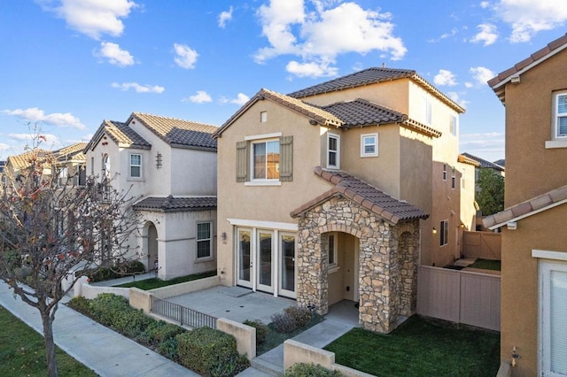 mediterranean / spanish-style home featuring a patio