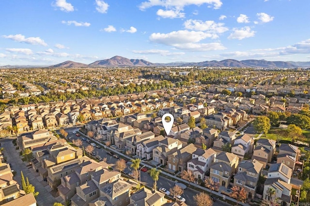 birds eye view of property with a residential view and a mountain view