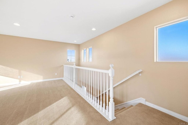 interior space featuring carpet, baseboards, and recessed lighting