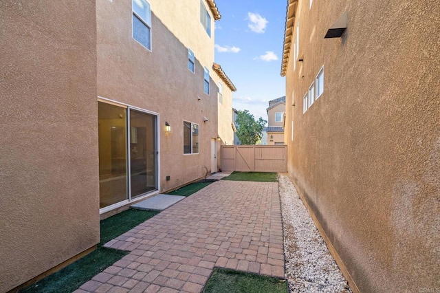 view of patio / terrace with a gate and fence