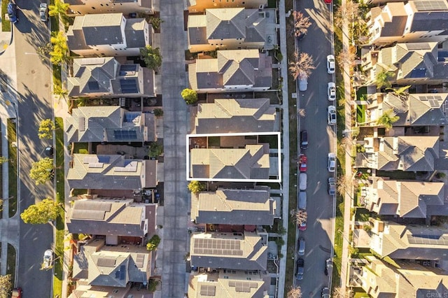 birds eye view of property with a residential view