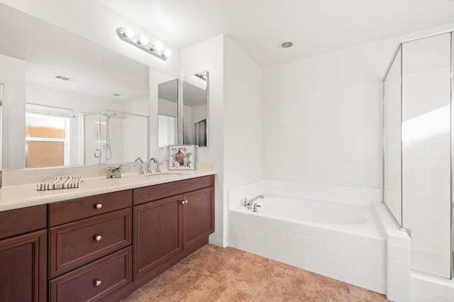 full bath with visible vents, a shower stall, vanity, and a bath