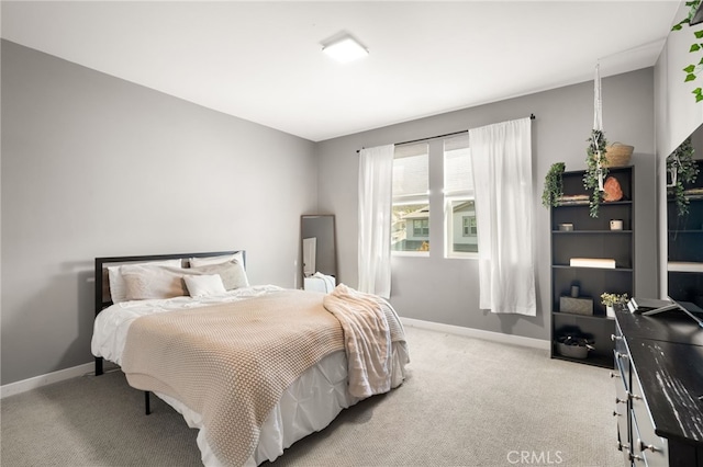 bedroom featuring light carpet