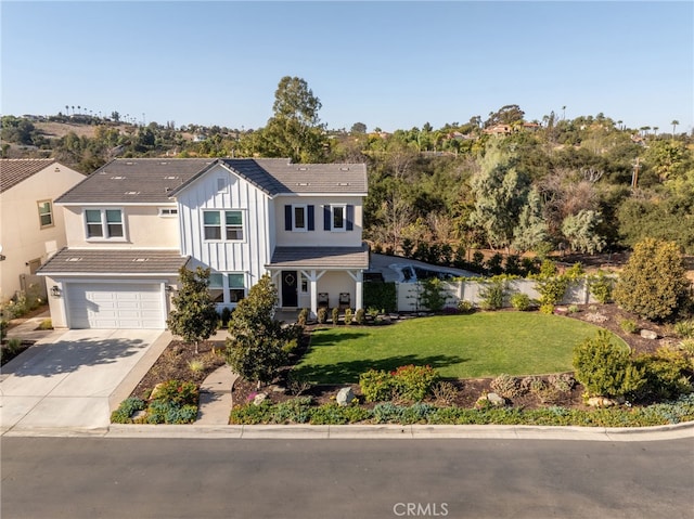 view of front of home with a front lawn and a garage