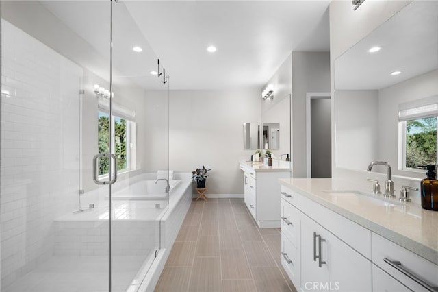 bathroom with vanity, tile patterned flooring, and independent shower and bath