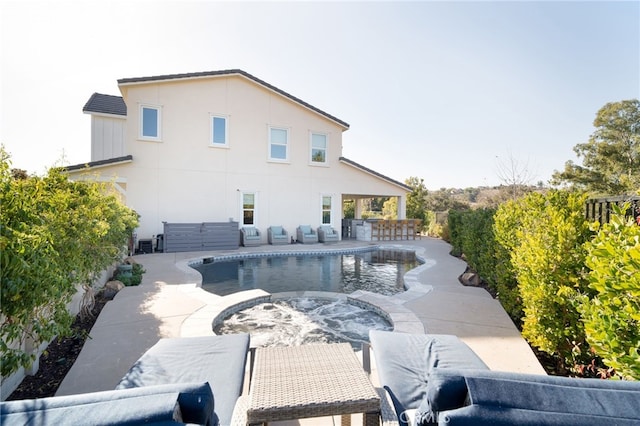 back of house featuring a patio and an outdoor bar