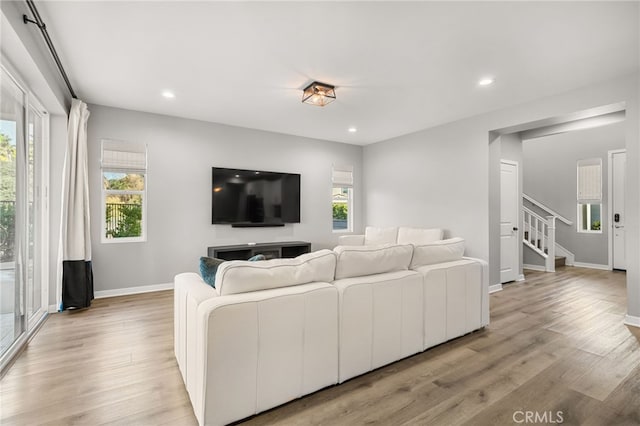 living room with light hardwood / wood-style floors