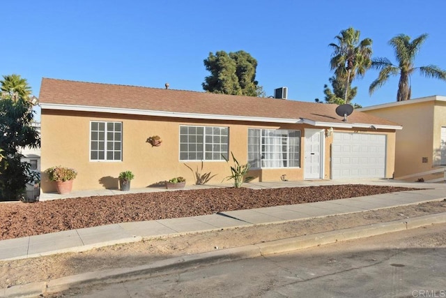 single story home with a garage