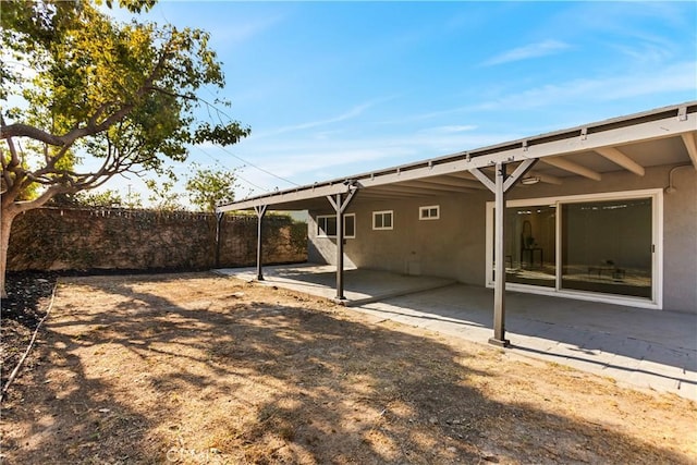 rear view of house with a patio