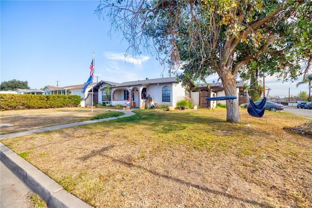 ranch-style house with a front yard