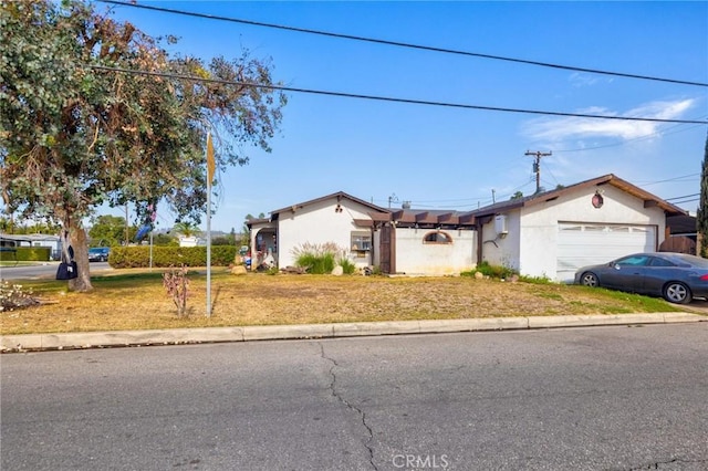 single story home featuring a garage