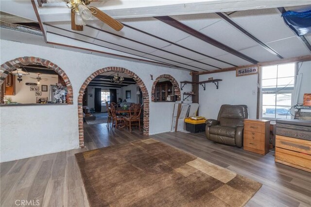 interior space featuring dark wood-type flooring and ceiling fan