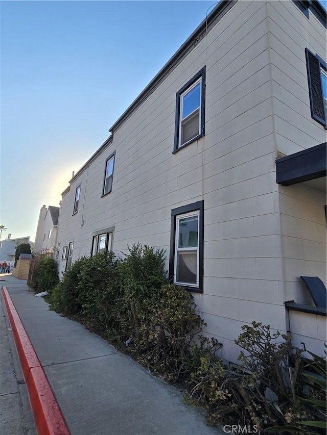 view of property exterior at dusk