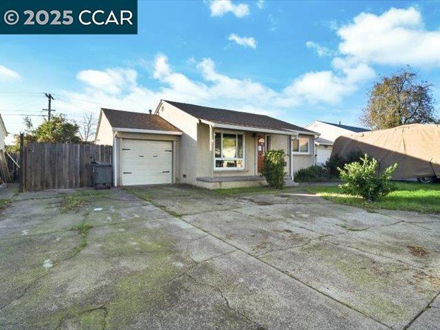 single story home featuring a garage