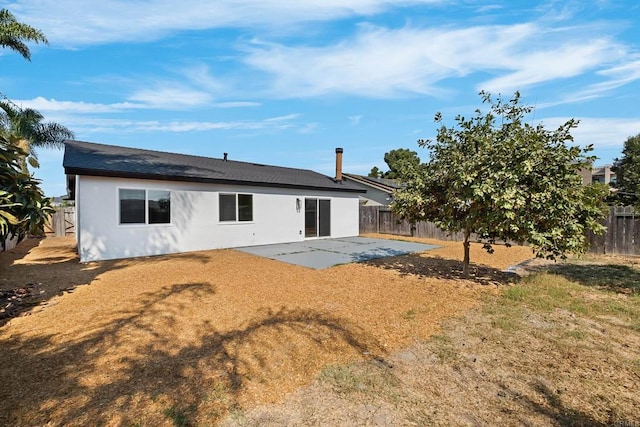 rear view of property featuring a patio area