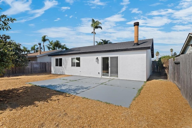 rear view of house with a patio