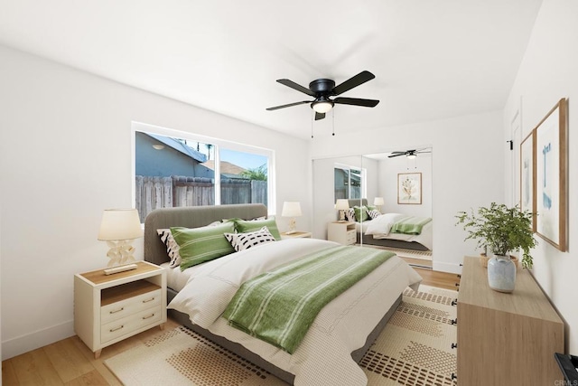 bedroom featuring ceiling fan and light hardwood / wood-style flooring