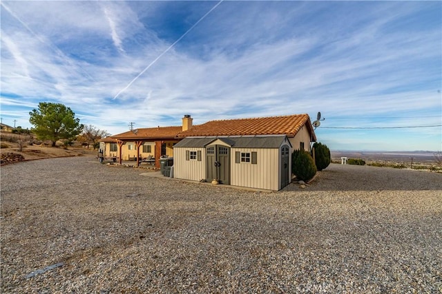 exterior space featuring a storage shed