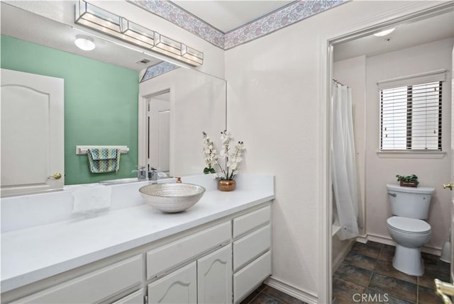 full bathroom featuring toilet, vanity, and shower / bathtub combination with curtain